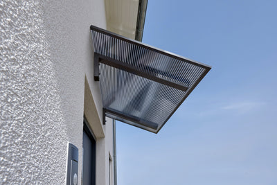 Pultvordach Bielefeld mit 16 mm Polycarbonat Stegplatte klar/anthrazit Zebraplatte